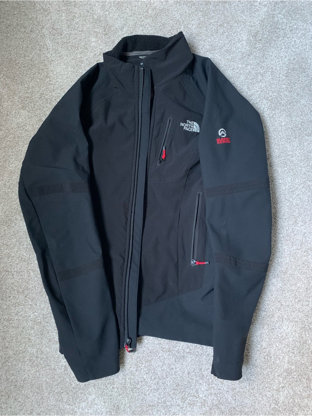 The North Face Black Softshell Performance Jacket with Red Accents